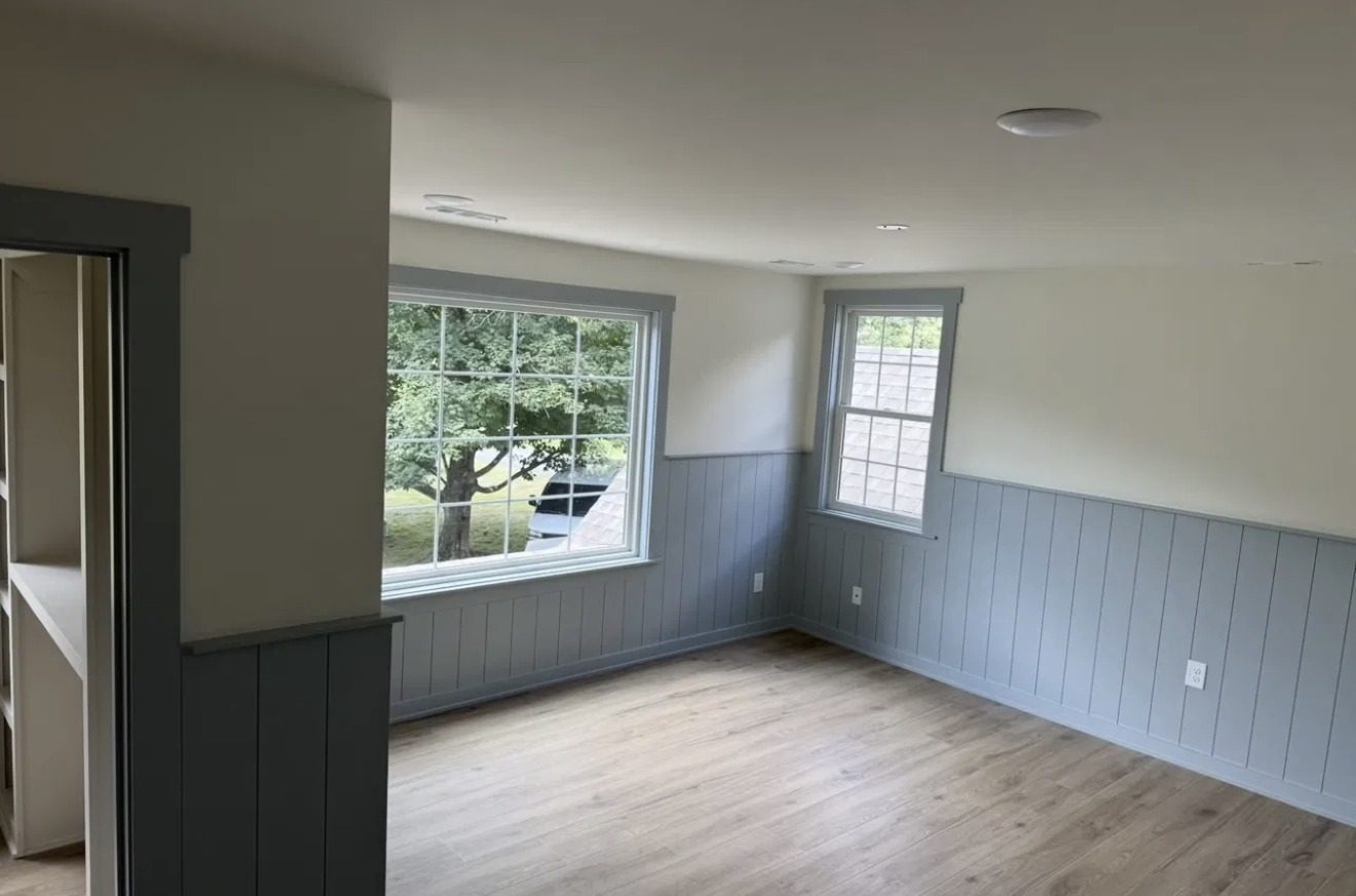 Bedroom with shiplap wainscot