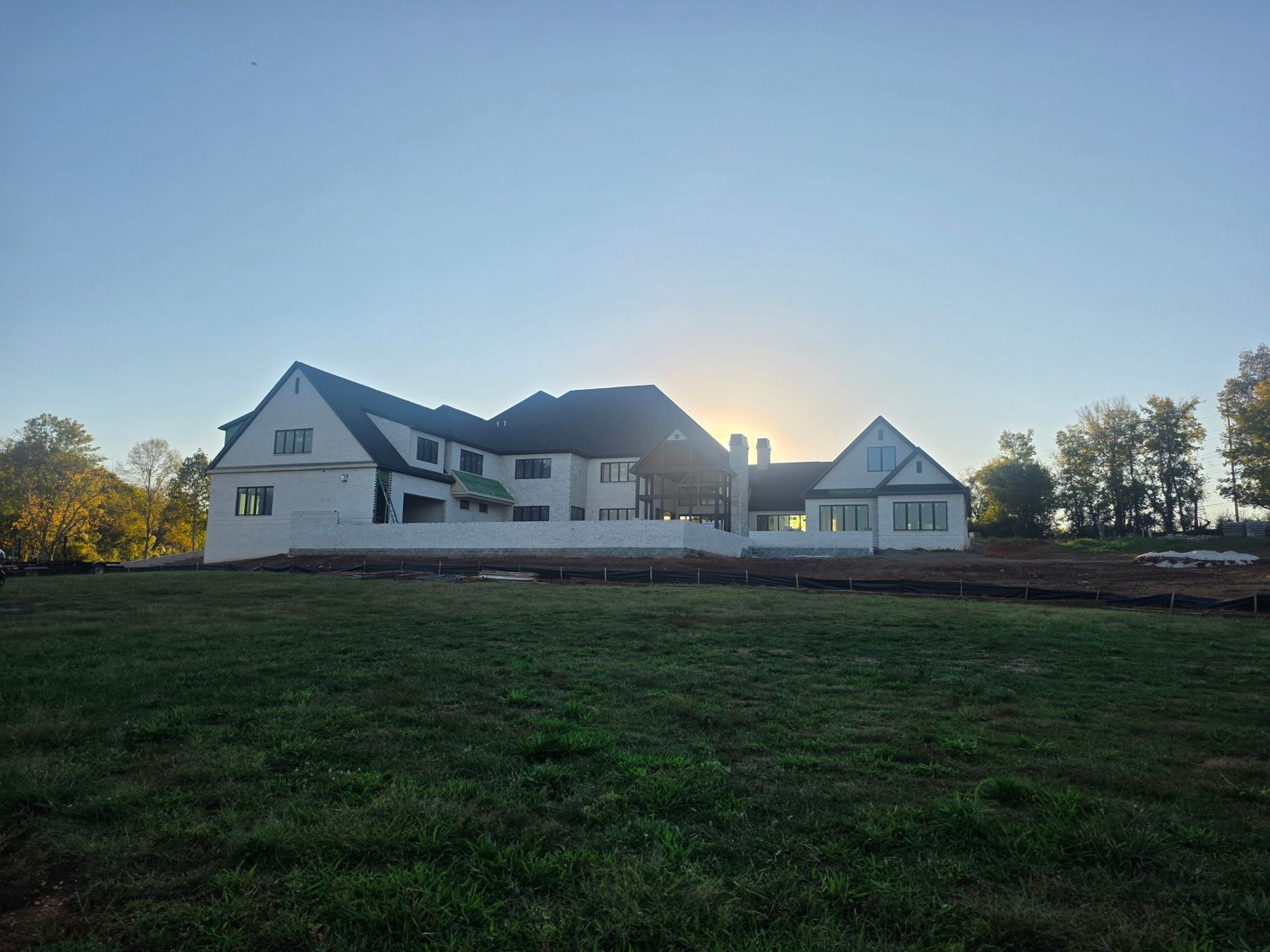 Rear elevation at sunrise above the lawn