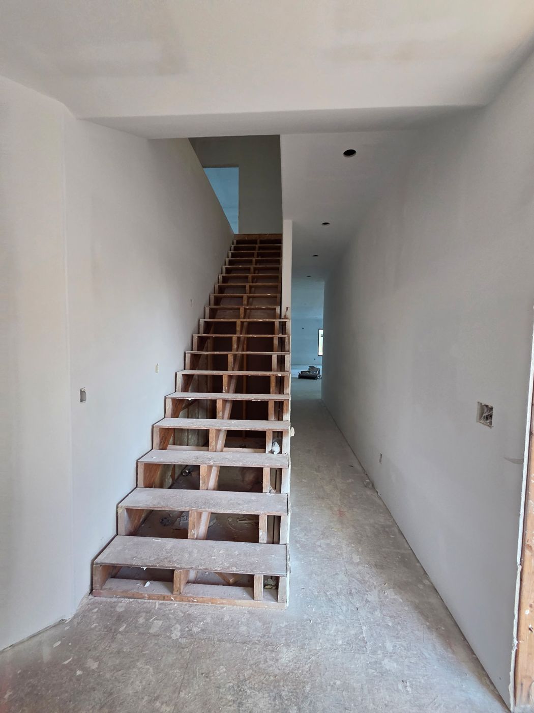 Main stair framed with temporary treads
